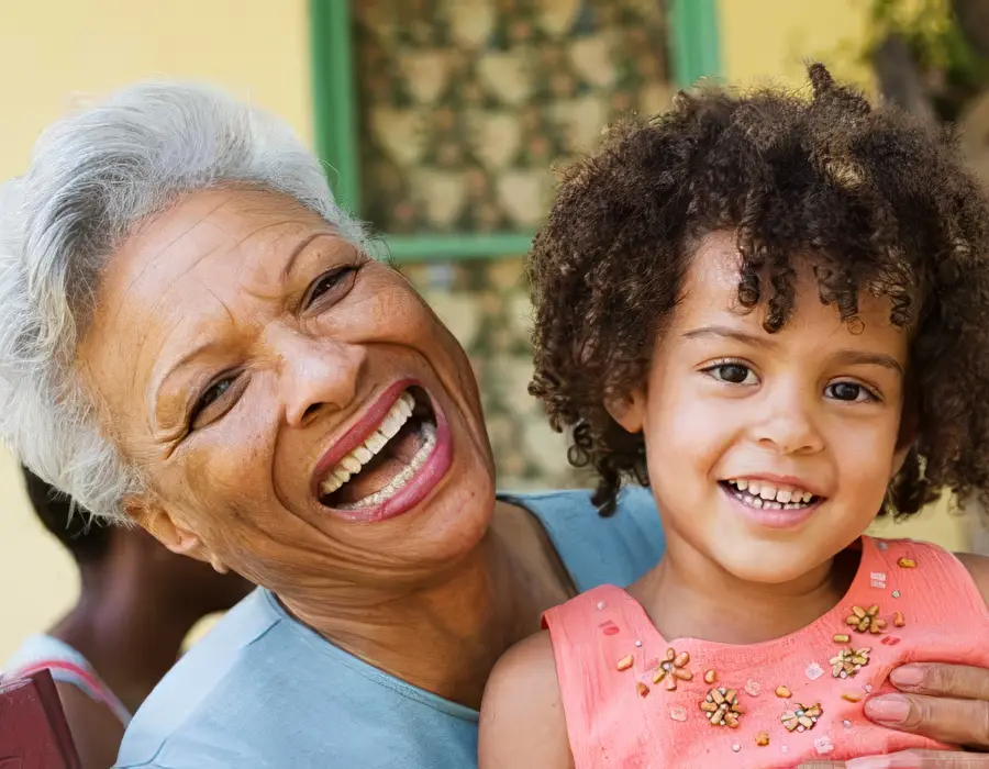 Grandmother laughing with granddaughter