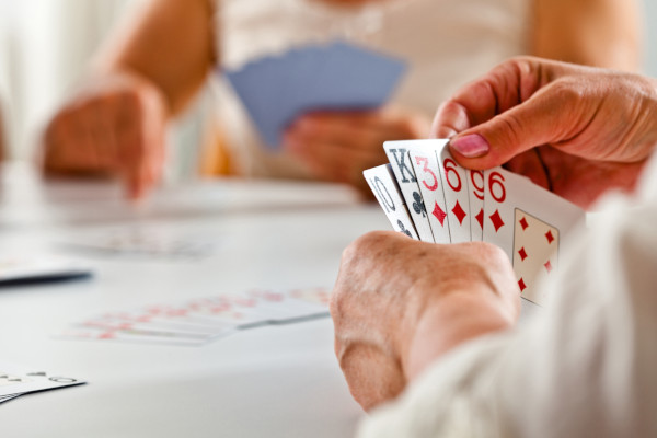 A group of people playing cards